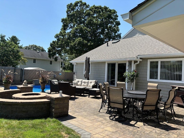 view of patio / terrace featuring an outdoor living space with a fire pit