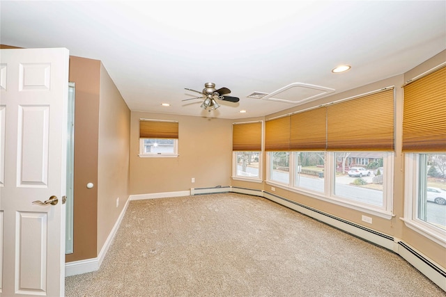 carpeted empty room featuring a baseboard radiator and ceiling fan