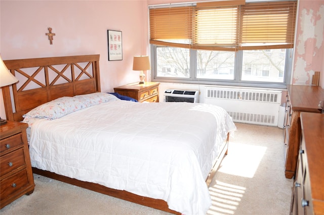 bedroom featuring light colored carpet, radiator heating unit, a wall mounted AC, and multiple windows