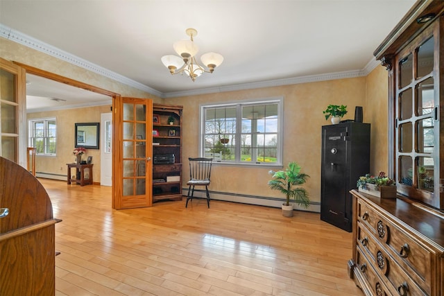 living area featuring a baseboard heating unit, an inviting chandelier, crown molding, and light wood-style flooring