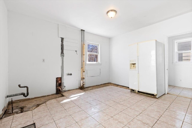 laundry area featuring light tile patterned flooring