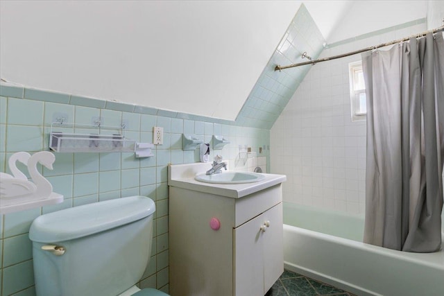 full bathroom with toilet, vanity, tile walls, vaulted ceiling, and shower / bath combination with curtain