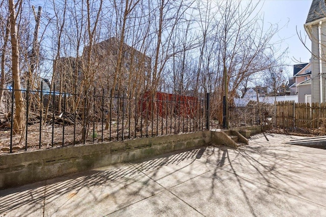 view of patio / terrace featuring fence