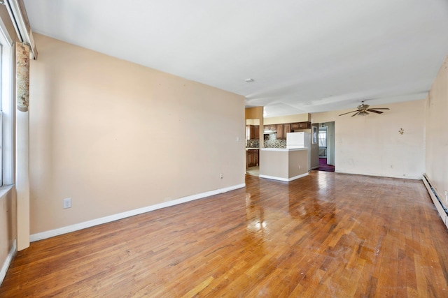 unfurnished living room with hardwood / wood-style floors and ceiling fan