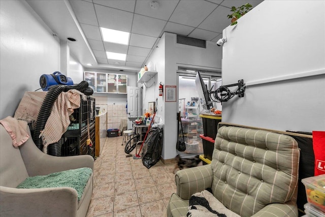 interior space featuring a drop ceiling