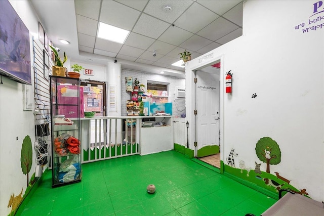 playroom with a drop ceiling