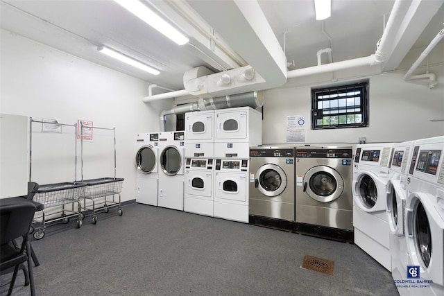 clothes washing area featuring stacked washing maching and dryer and washing machine and dryer