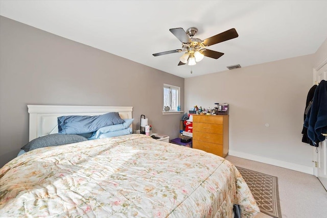 carpeted bedroom with ceiling fan