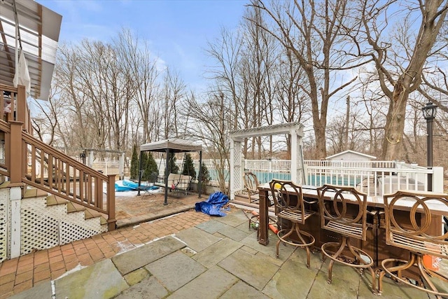 view of patio featuring a covered pool