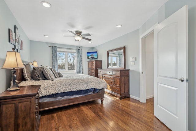 bedroom with wood-type flooring and ceiling fan