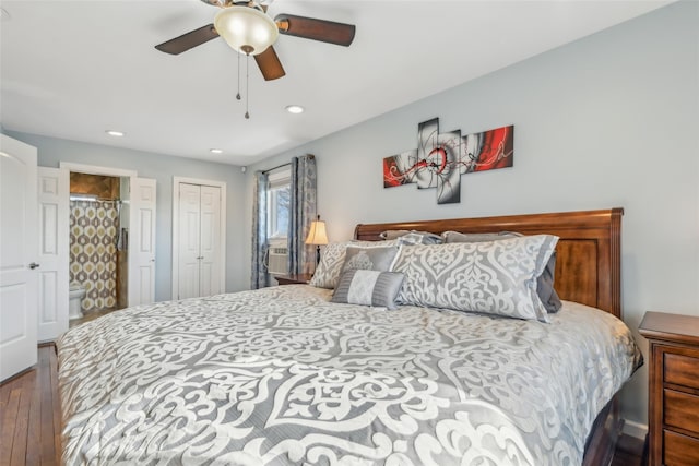 bedroom with connected bathroom, wood-type flooring, a closet, and ceiling fan