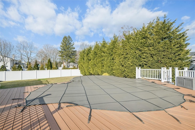 view of swimming pool featuring a deck