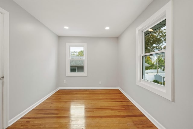 spare room featuring hardwood / wood-style floors