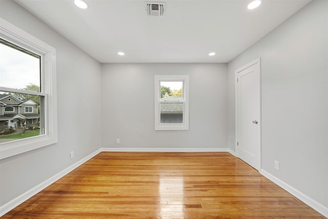 spare room with light wood-type flooring