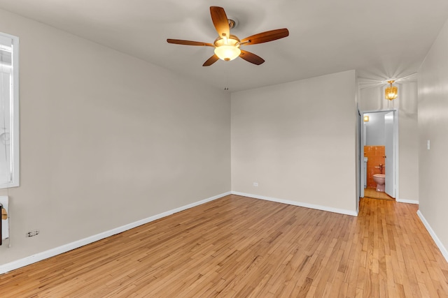 spare room featuring ceiling fan and light hardwood / wood-style floors