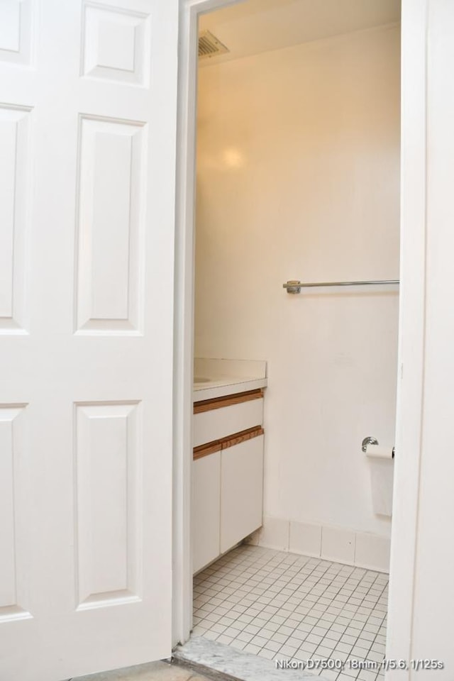 bathroom with vanity and tile patterned floors