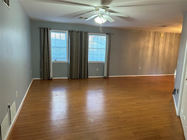 empty room featuring ceiling fan and wood-type flooring