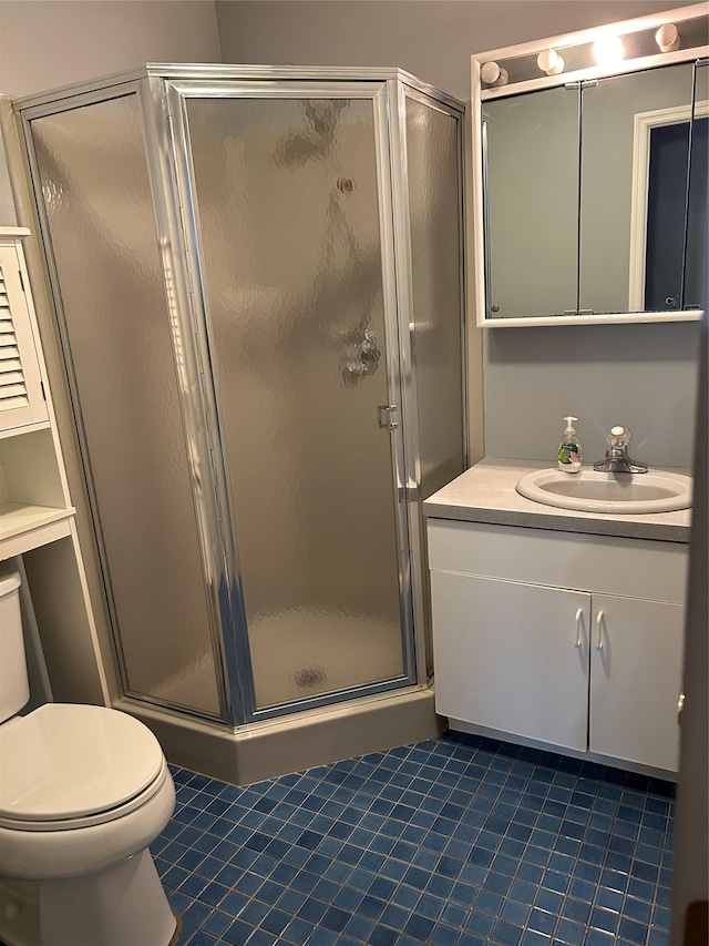 bathroom featuring walk in shower, tile patterned floors, vanity, and toilet