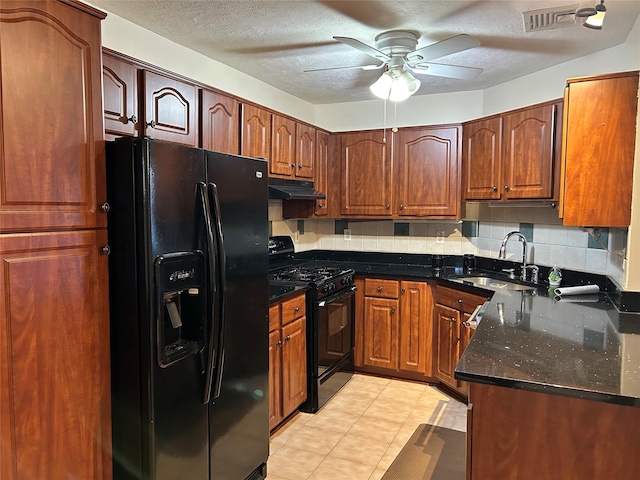 kitchen featuring sink, ceiling fan, black appliances, a textured ceiling, and decorative backsplash