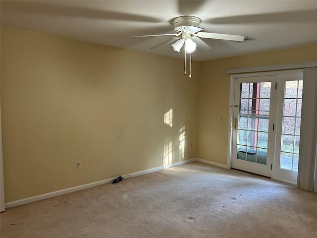 carpeted empty room with ceiling fan