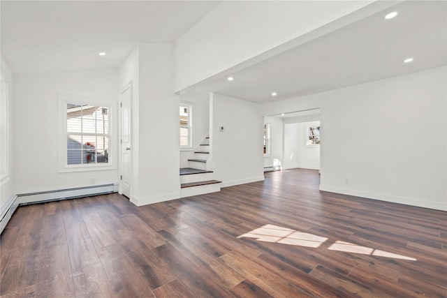 empty room featuring stairs, baseboards, dark wood finished floors, and recessed lighting