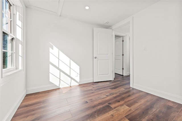 unfurnished room with baseboards, dark wood-style flooring, and recessed lighting