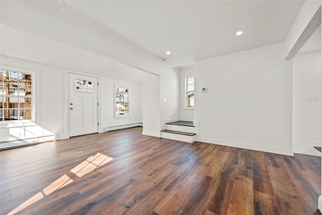 foyer entrance featuring a baseboard heating unit, recessed lighting, dark wood-type flooring, and baseboards