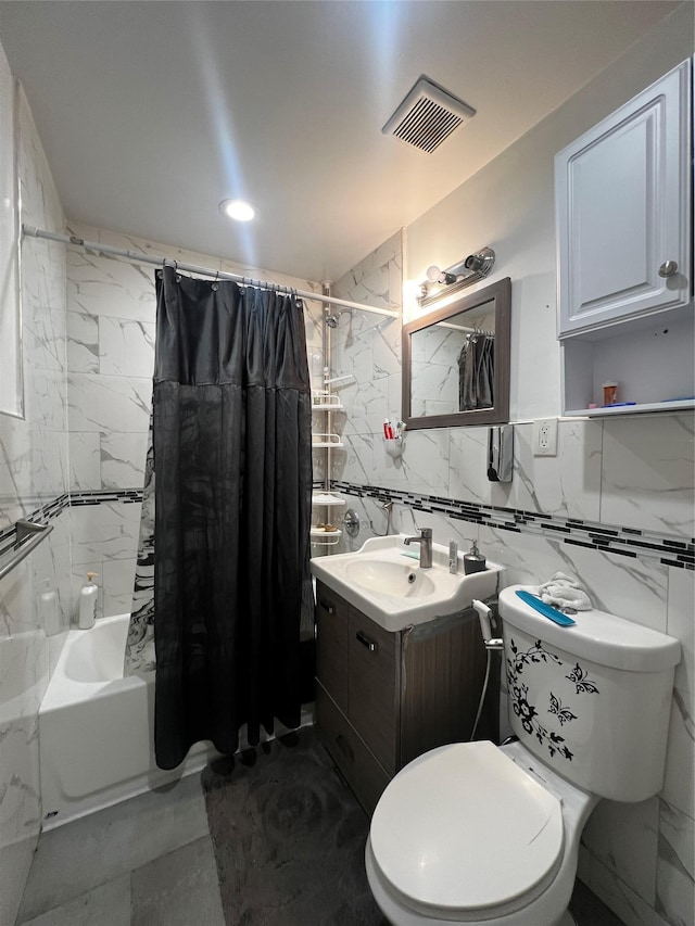 full bathroom with vanity, tile walls, shower / bath combination with curtain, and toilet