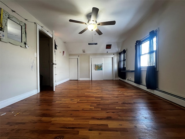 unfurnished bedroom featuring ceiling fan and dark hardwood / wood-style flooring