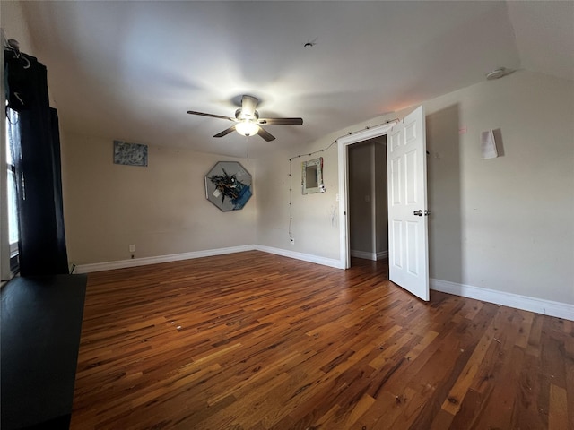 unfurnished room with ceiling fan and dark hardwood / wood-style flooring