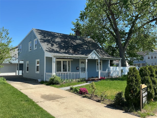159 Spring Ln, Levittown, NY 11756 - view of front of house with covered porch, a chimney, an outdoor structure, roof with shingles, and a front lawn