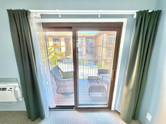 entryway featuring carpet flooring