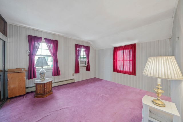 sitting room with a baseboard heating unit, vaulted ceiling, and carpet