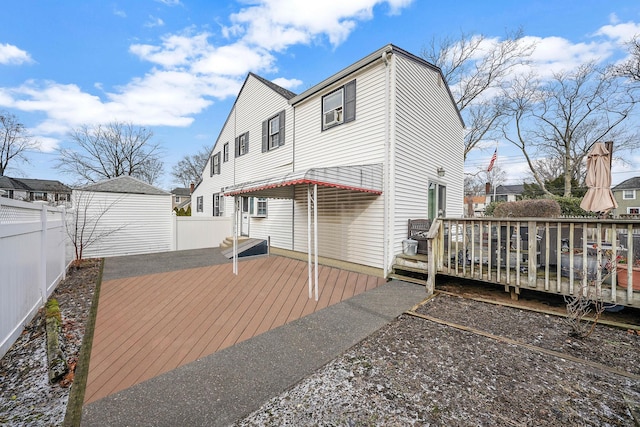 rear view of property with a wooden deck