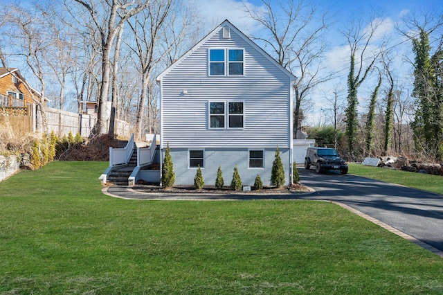 view of home's exterior featuring a yard