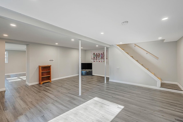 basement featuring light hardwood / wood-style floors