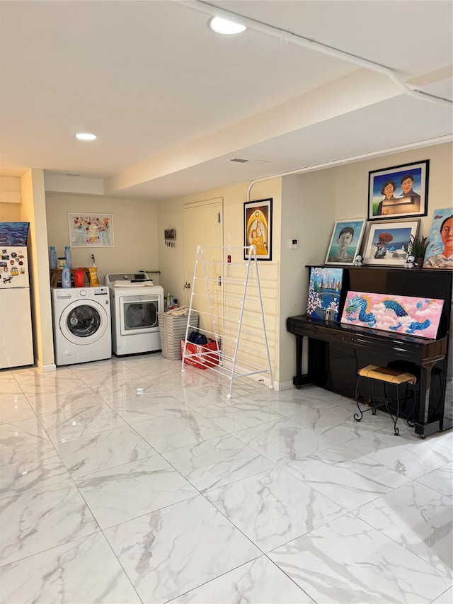 laundry room with washing machine and dryer