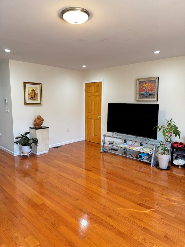 living room with light hardwood / wood-style floors