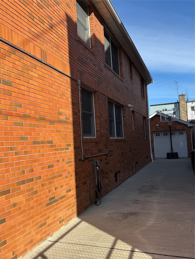 view of home's exterior featuring a garage and an outdoor structure