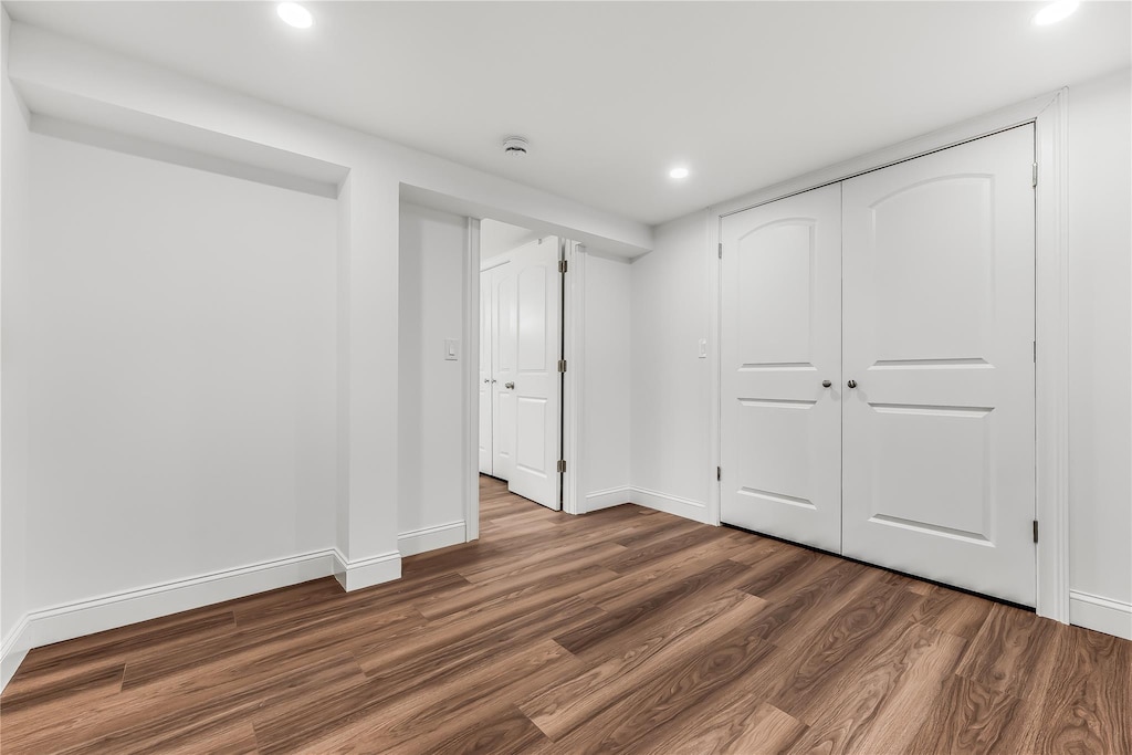 basement featuring dark hardwood / wood-style floors