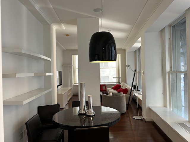 dining space featuring dark wood-type flooring