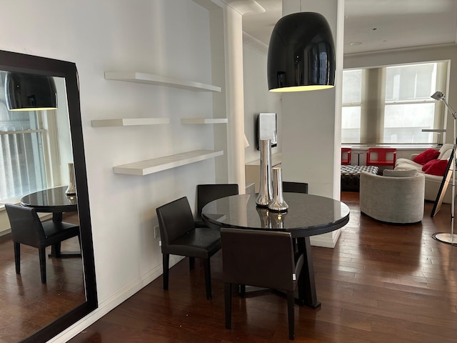 dining space featuring dark wood-type flooring