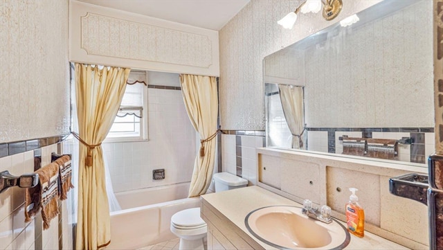 full bathroom featuring tile walls, tile patterned flooring, vanity, shower / tub combo, and toilet