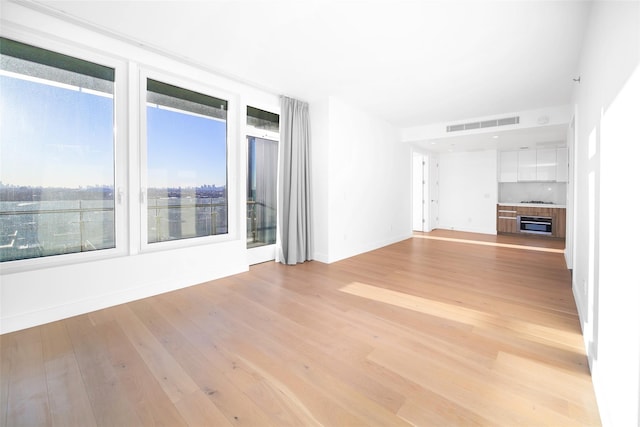 unfurnished living room featuring light hardwood / wood-style flooring