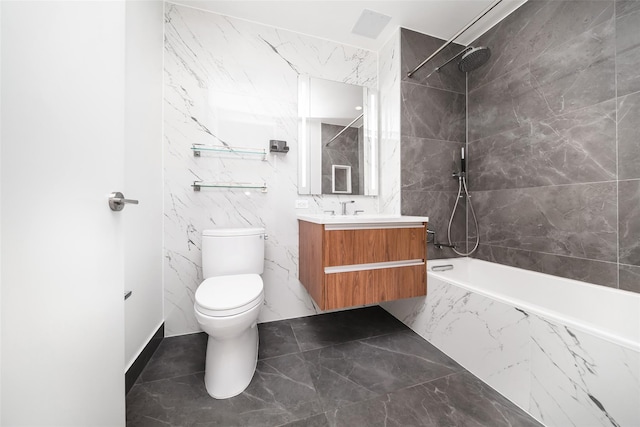 full bathroom with tiled shower / bath combo, vanity, tile walls, and toilet