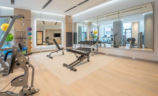 gym with hardwood / wood-style flooring