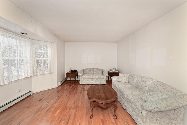 living room featuring hardwood / wood-style floors and a baseboard radiator