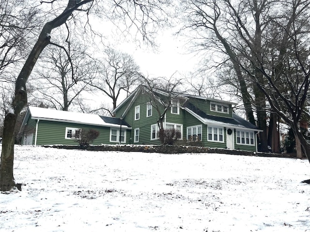 view of snow covered house