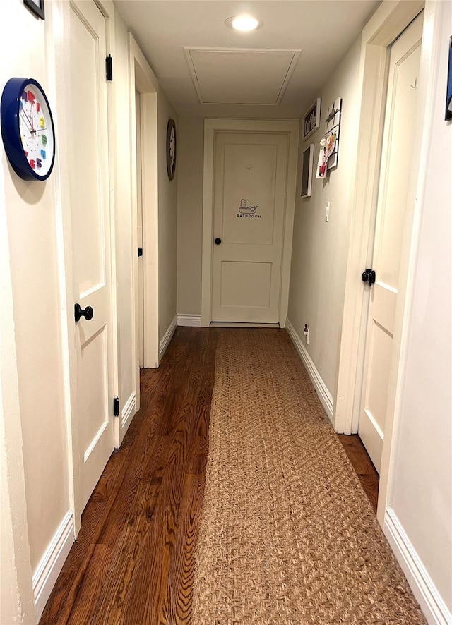 corridor featuring dark hardwood / wood-style floors