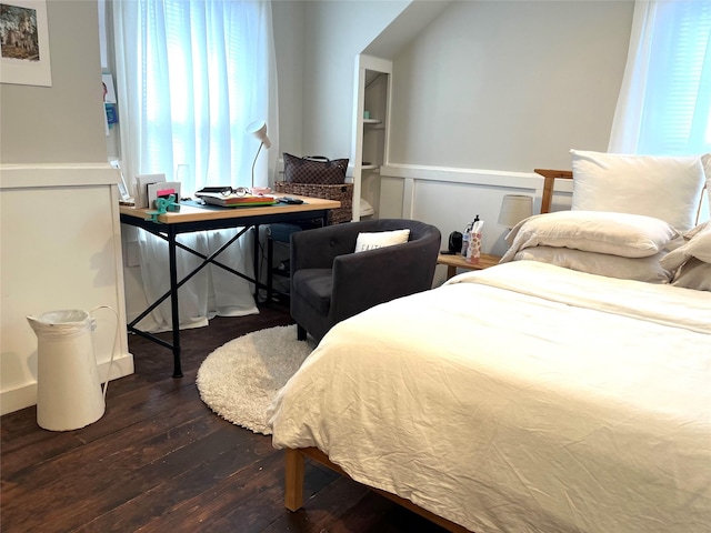 bedroom featuring dark hardwood / wood-style flooring